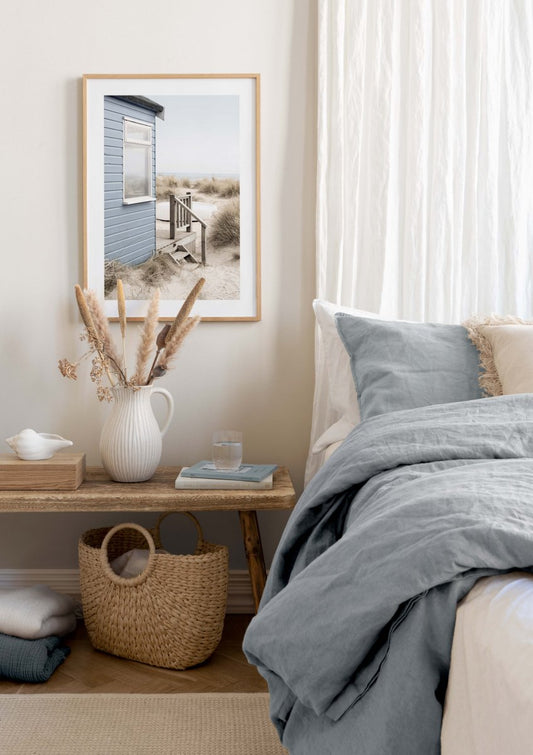 Watercolor beach house poster for nursery and home wall decor.