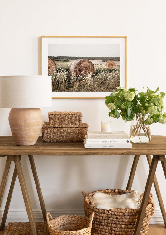 Watercolor hay on meadow poster for nursery and home wall decor.